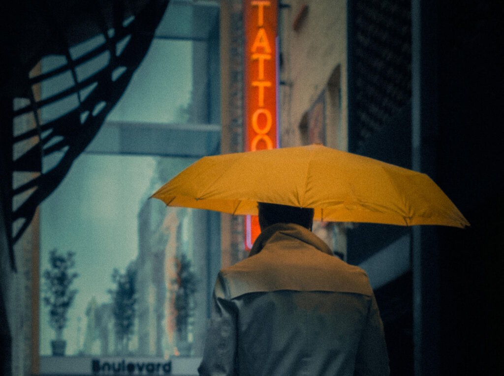 Man with a yellow umbrella