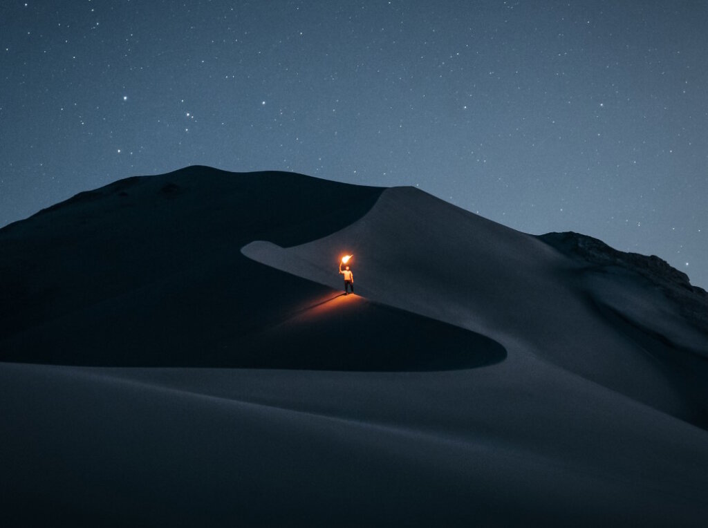 Person in a desert at night