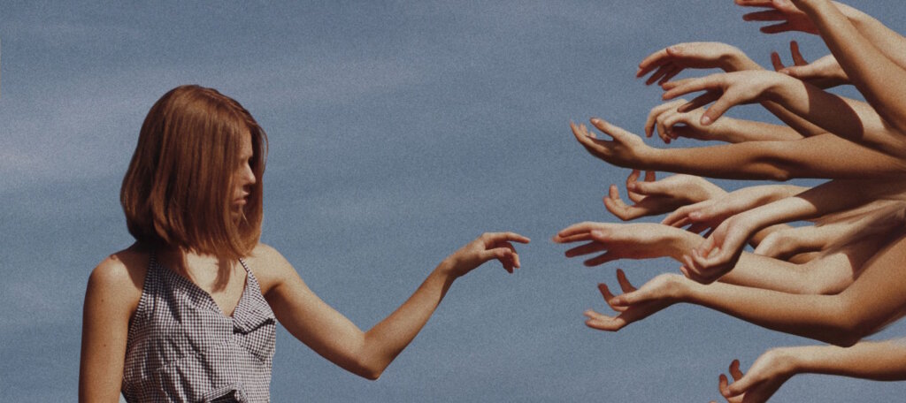 Woman pointing to multiple hands - Surrealism in Art and Design