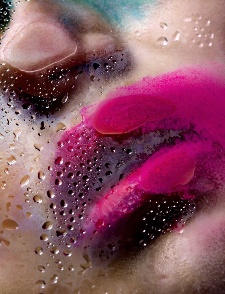 Woman's Lips Pressed Against A Glass Window