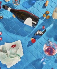 Drinks And Olives Are Scattered Across A Blue Tiled Surface With A Bottle And Glass Tipped Over And Spilled Drinks