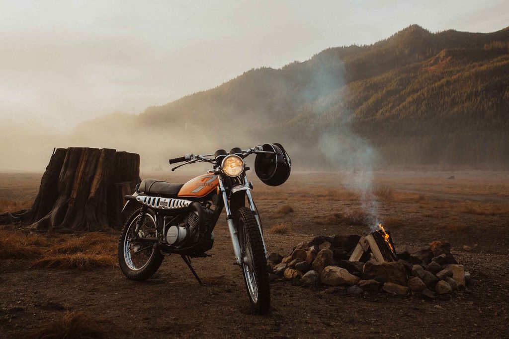 An Orange Vintage Motorcycle Parked